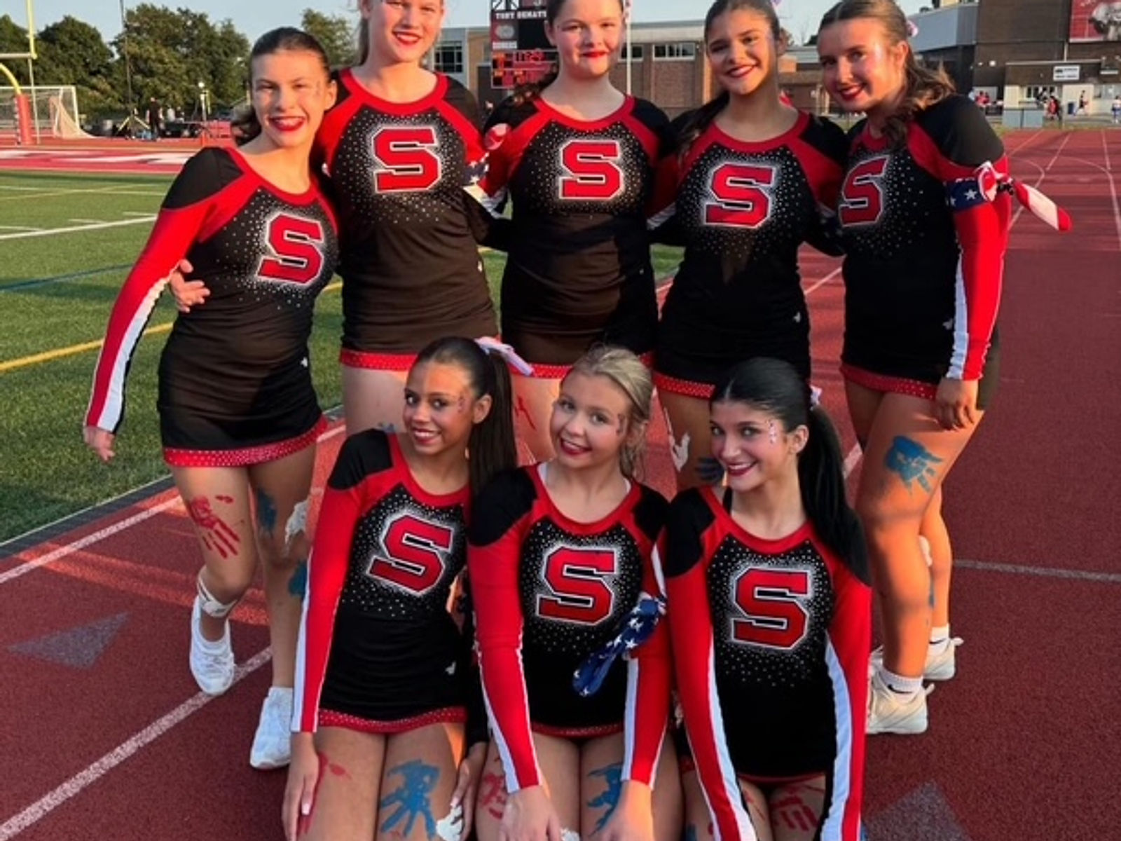 Somers cheerleaders showing school spirit on the track